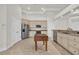 Bright kitchen with stainless steel appliances, granite countertops, and a functional center island at 3791 Cagney Ln., Myrtle Beach, SC 29577