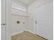 A laundry room with a white door and a wire rack at 3791 Cagney Ln., Myrtle Beach, SC 29577