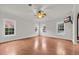 Spacious living room with hardwood floors and large windows offering natural light at 3791 Cagney Ln., Myrtle Beach, SC 29577