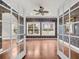 Formal living room with hardwood floors and detailed trim, viewed through glass French doors at 3791 Cagney Ln., Myrtle Beach, SC 29577