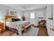 Light-filled bedroom featuring wood floors, coastal decor, and a door to the outside at 3866 Highway 17 Business # C- 9, Murrells Inlet, SC 29576