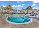 Sparkling community pool surrounded by colorful townhomes and palm trees at 3866 Highway 17 Business # C- 9, Murrells Inlet, SC 29576