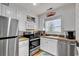 Bright kitchen with stainless steel appliances, white cabinetry, and wood countertops under a window at 3866 Highway 17 Business # C- 9, Murrells Inlet, SC 29576