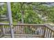 Backyard canal view from the wooden deck, showcasing the lush greenery and waterway at 3866 Highway 17 Business # C- 9, Murrells Inlet, SC 29576