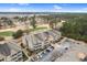 Aerial view of condo buildings, parking, golf course and surrounding neighborhood at 395 S Crow Creek Dr. # 1418, Calabash, NC 28467