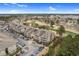 Aerial view of community with buildings, golf course, parking and mature trees at 395 S Crow Creek Dr. # 1418, Calabash, NC 28467