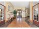 Community lobby with dark stained flooring and light walls with large plant in center at 395 S Crow Creek Dr. # 1418, Calabash, NC 28467