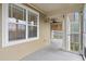 Exterior screened in porch with full window, ceiling fan, and bamboo shade fixture at 395 S Crow Creek Dr. # 1418, Calabash, NC 28467