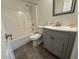 Cozy bathroom with shower, tiled floors, and a gray vanity with modern fixtures at 3955 Gladiola Ct. # 301, Myrtle Beach, SC 29588