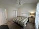 Bright bedroom featuring neutral carpet, ceiling fan, and white trim at 3955 Gladiola Ct. # 301, Myrtle Beach, SC 29588