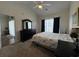 Bright bedroom with vaulted ceiling, black dresser, and lots of natural light at 3955 Gladiola Ct. # 301, Myrtle Beach, SC 29588