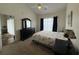 Vaulted main bedroom featuring a ceiling fan, neutral carpet, and modern furniture at 3955 Gladiola Ct. # 301, Myrtle Beach, SC 29588