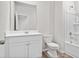 Cozy, clean bathroom featuring a shower-tub combo, toilet, and a vanity with a large mirror at 409 Falling Leaf Loop, Myrtle Beach, SC 29588