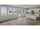 Open-concept kitchen and living area, with luxury vinyl plank flooring and natural light at 409 Falling Leaf Loop, Myrtle Beach, SC 29588