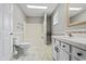 Bright bathroom featuring a shower and tub combo and a modern vanity and sink setup at 410 Martin St., Mullins, SC 29574