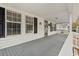 Charming front porch with painted deck and classic white railings offering a welcoming entrance at 410 Martin St., Mullins, SC 29574