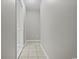 Hallway with tile floor and fresh paint plus a closed door on the left to a room at 410 Martin St., Mullins, SC 29574