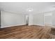 Hardwood floors enhance this living room space with neutral walls and recessed lighting at 410 Martin St., Mullins, SC 29574