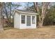 Exterior view of storage building with windows, door, and white siding at 410 Martin St., Mullins, SC 29574