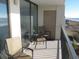 Relax on this balcony with seating and ocean views; perfect for unwinding and enjoying the scenery at 4111 Ocean Blvd. S # 402, North Myrtle Beach, SC 29582