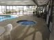 Soak in the indoor hot tub with pool access, next to comfortable seating, and lush tropical plants at 4111 Ocean Blvd. S # 402, North Myrtle Beach, SC 29582