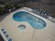 Aerial view of pool and hot tub with many chairs to relax on at 4111 Ocean Blvd. S # 402, North Myrtle Beach, SC 29582