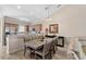 Open dining area featuring modern table and chairs, seamlessly flowing into the adjacent kitchen at 4140 Hibiscus Dr. # 303, Little River, SC 29566