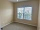 Bedroom with plush carpet and a bright window providing ample natural light at 422 Cassian Way, Myrtle Beach, SC 29588