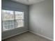 Neutral bedroom with large window and plush carpeting, ideal for relaxation at 422 Cassian Way, Myrtle Beach, SC 29588