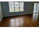 Open living room featuring hardwood floors and a sliding glass door at 422 Cassian Way, Myrtle Beach, SC 29588