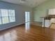 Open-concept living area with hardwood floors connecting to a modern kitchen at 422 Cassian Way, Myrtle Beach, SC 29588