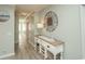 Inviting hallway with console table, stylish decor, and plank flooring at 4220 Coquina Harbour Dr. # B-12, Little River, SC 29566