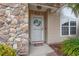 Charming front door with a decorative wreath and a 'welcome' mat at 4309 River Gate Ln., Little River, SC 29566