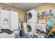 Practical laundry room equipped with a washer, dryer, and ample storage at 4309 River Gate Ln., Little River, SC 29566