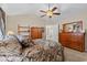 Spacious bedroom featuring vaulted ceiling, ceiling fan and hardwood furnishings at 4309 River Gate Ln., Little River, SC 29566