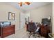 Cozy home office with neutral carpet, a view to an adjacent room, and a desk at 4309 River Gate Ln., Little River, SC 29566