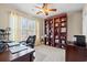 Comfortable home office with a built in bookcase, a large window, and ample desk space at 4309 River Gate Ln., Little River, SC 29566