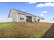 View of the home's backyard, featuring a well-maintained lawn and patio area at 453 Rycola Circle, Surfside Beach, SC 29575