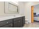 Well-lit bathroom with a modern vanity, framed mirror, and a sliding door for added style and privacy at 453 Rycola Circle, Surfside Beach, SC 29575