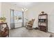 Cozy breakfast nook with hardwood floors, chandelier, and a view of the landscaped yard at 453 Rycola Circle, Surfside Beach, SC 29575