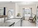 Granite kitchen island featuring stainless steel appliances and a view into the breakfast nook at 453 Rycola Circle, Surfside Beach, SC 29575