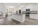 Modern kitchen with stainless steel appliances, granite counters, and white cabinetry at 453 Rycola Circle, Surfside Beach, SC 29575