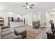 Bright living room showcasing an open concept layout, gray floors and a ceiling fan at 453 Rycola Circle, Surfside Beach, SC 29575