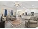 Spacious living room featuring hardwood floors, a ceiling fan and an open floor plan at 453 Rycola Circle, Surfside Beach, SC 29575