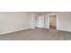 A carpeted bedroom featuring a white door to the bathroom at 467 Acosta Circle, Conway, SC 29527