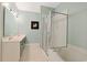 Bright bathroom showcasing double sinks, shower, and soaking tub at 48 Twelve Oaks Dr. # 2, Pawleys Island, SC 29585