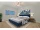 Well-lit bedroom featuring a comfortable bed and mountain artwork above at 48 Twelve Oaks Dr. # 2, Pawleys Island, SC 29585