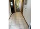 Hallway leads to the bedroom, with beige tile and carpet flooring at 4800 Ocean Blvd. S # 1616, North Myrtle Beach, SC 29582