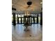 The lobby with tile floors, a chandelier, revolving doors, and palm trees at 4800 Ocean Blvd. S # 1616, North Myrtle Beach, SC 29582