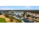 Aerial view of multi-Gathering residential buildings with golf course, landscaping, and parking at 5751 Oyster Catcher Dr. # 633, North Myrtle Beach, SC 29582